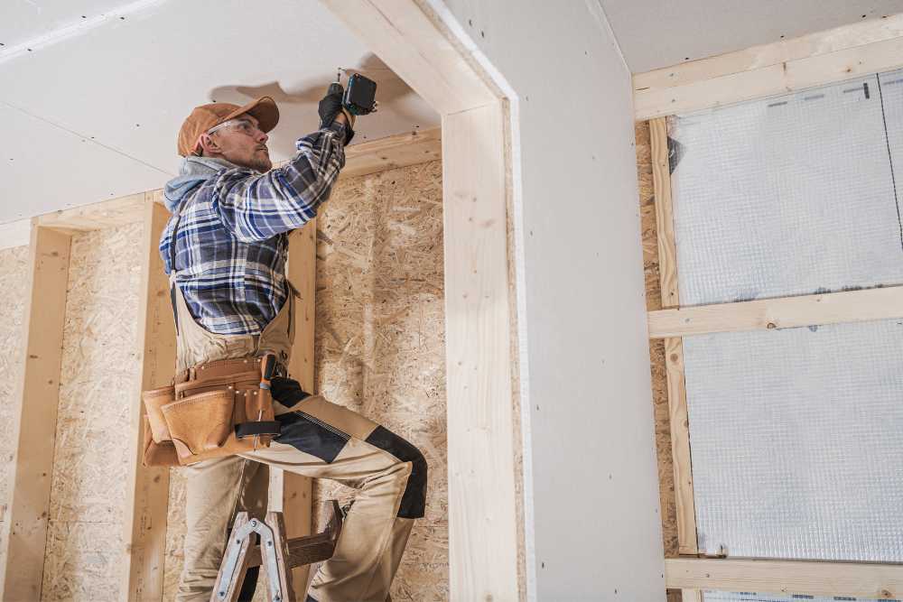 Contractor diligently working in an unfinished home construction site in Ventura County, provided by Nativi Construction.