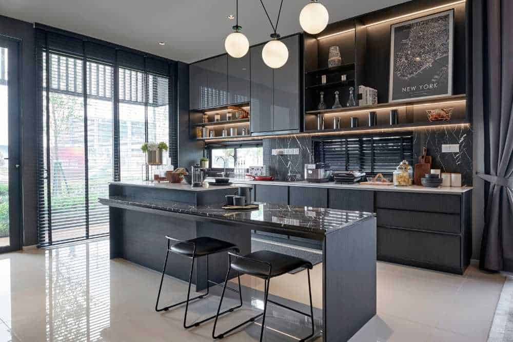 Chic modern kitchen designed with sophisticated black cabinets by Nativi Construction in Ventura County.